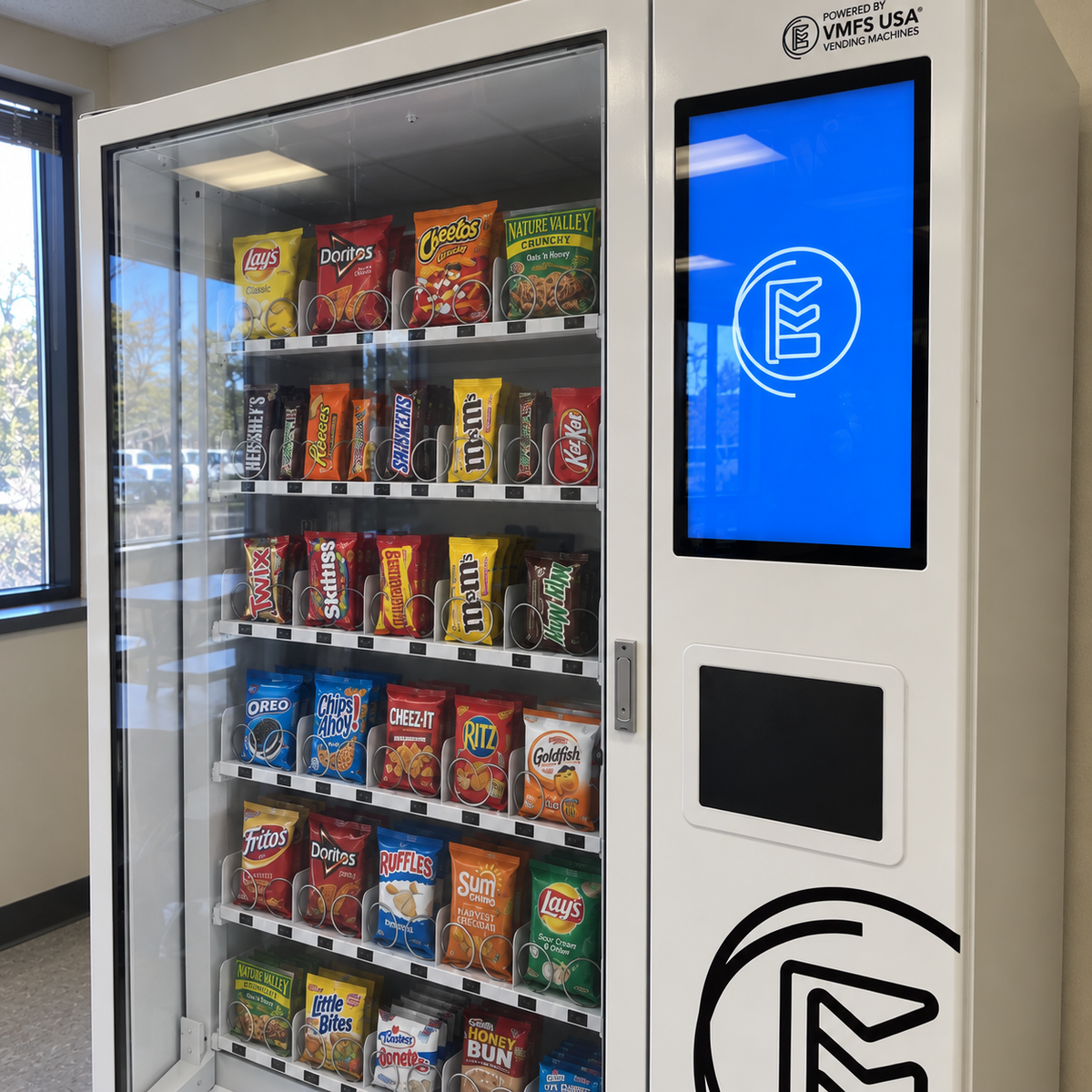 VMFS USA Snack vending machine with touch screen fully restocked with snacks including chips and chocolates 